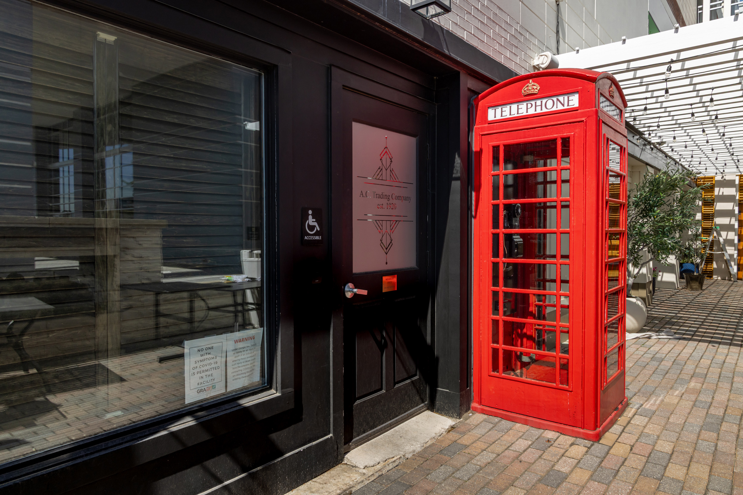 The restored red telephone booth outside a Red Phone Booth location